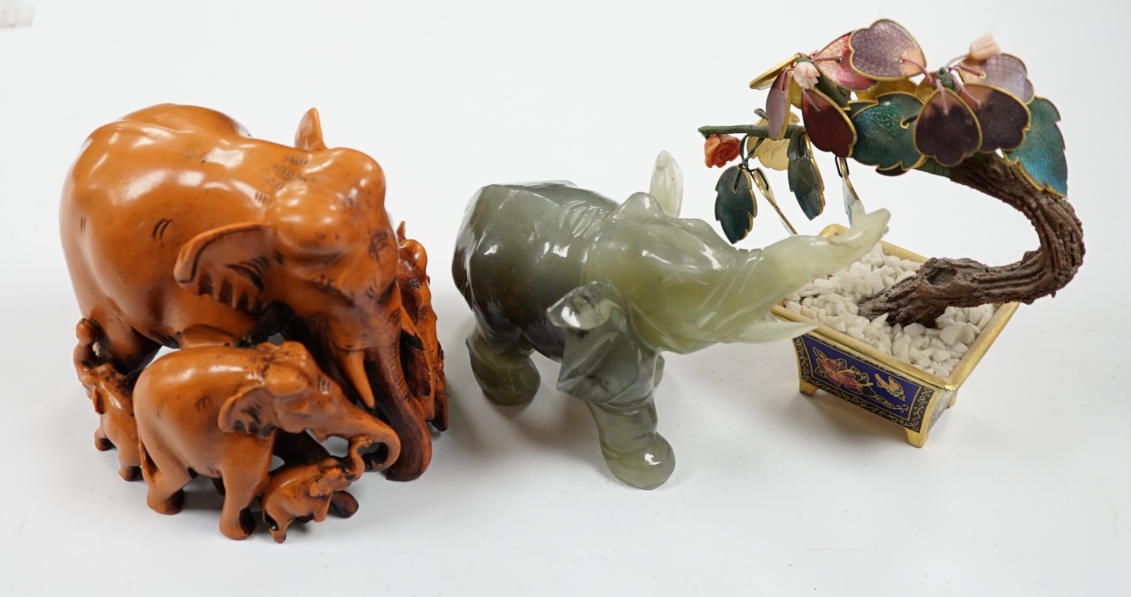 Assorted Chinese carvings, including enamel model bonsai trees, miniature ceramic folding screen, carved elephants, hardwood stands, and nephrite jade and green stone carved dragons, and horses, etc. Condition - varies